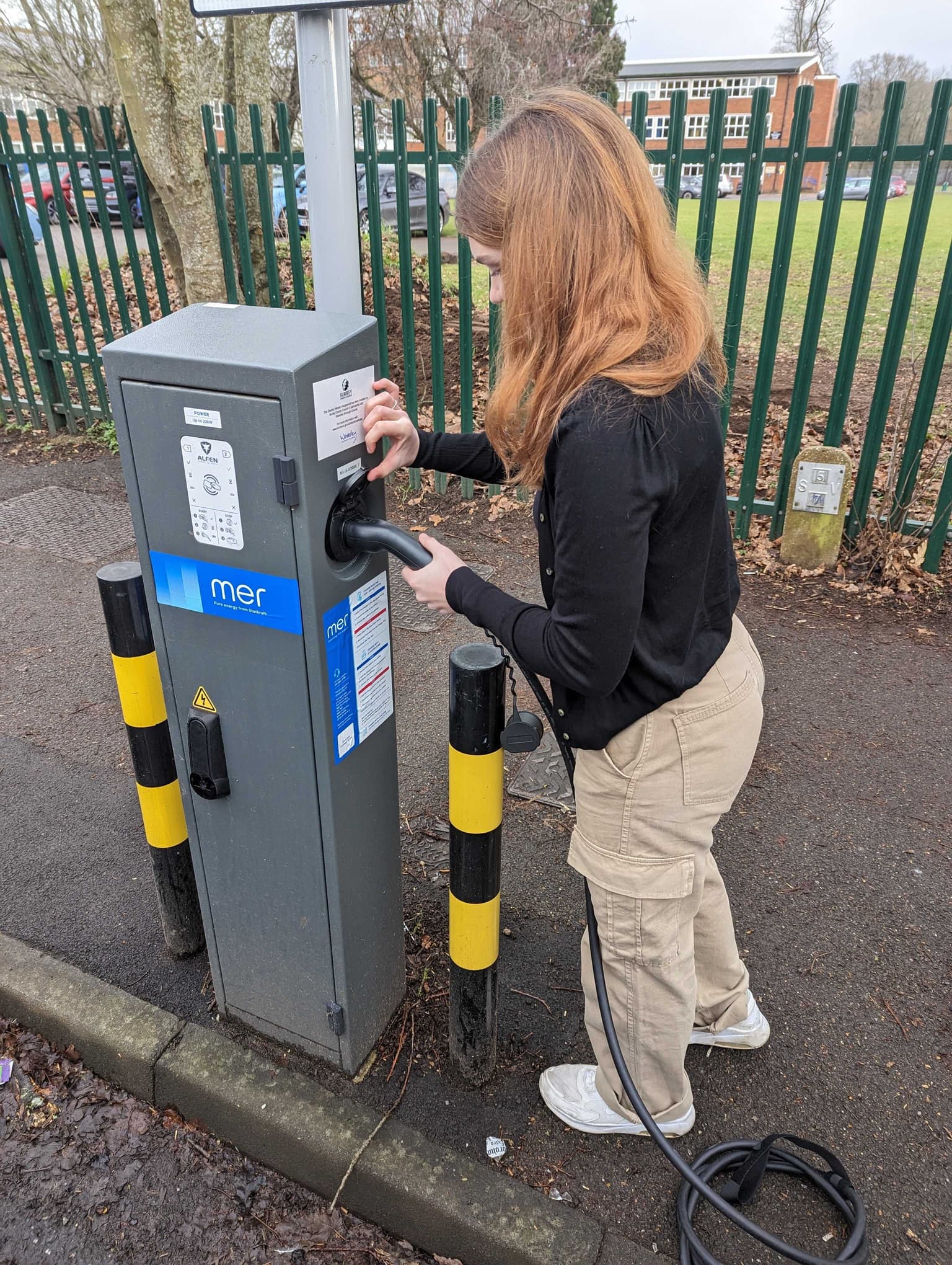 woman using MER electric charge point 