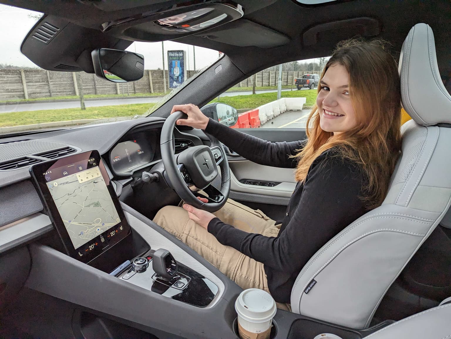 Woman driving an electric Polestar 2 