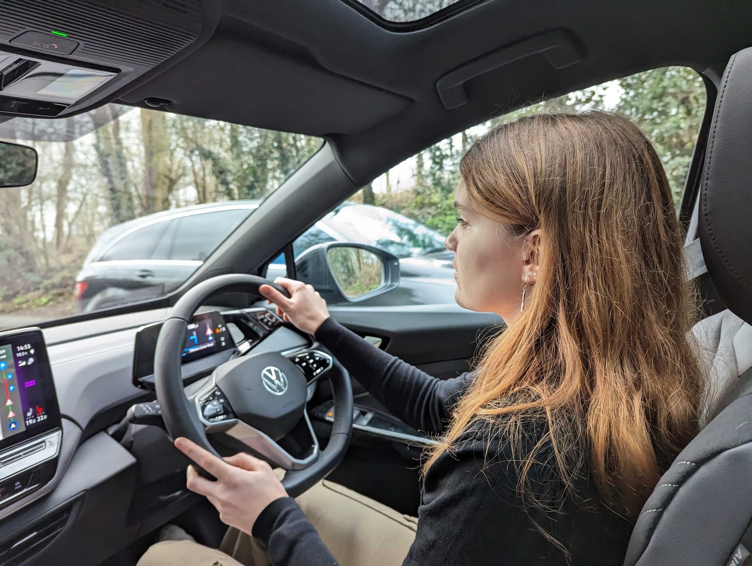 Woman drives an electric Volkswagen ID.5