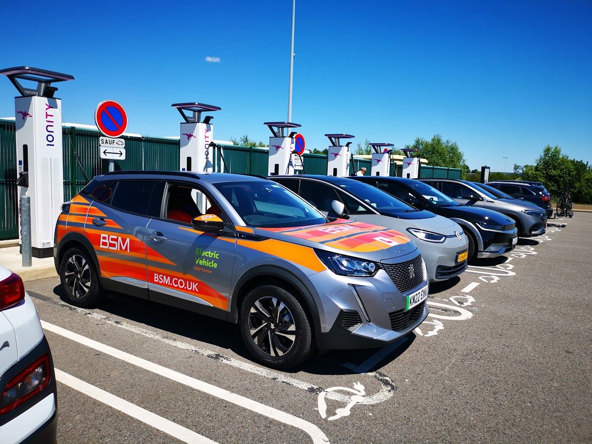 Photograph of peugeot e-208 charging at IONITY charging station in France