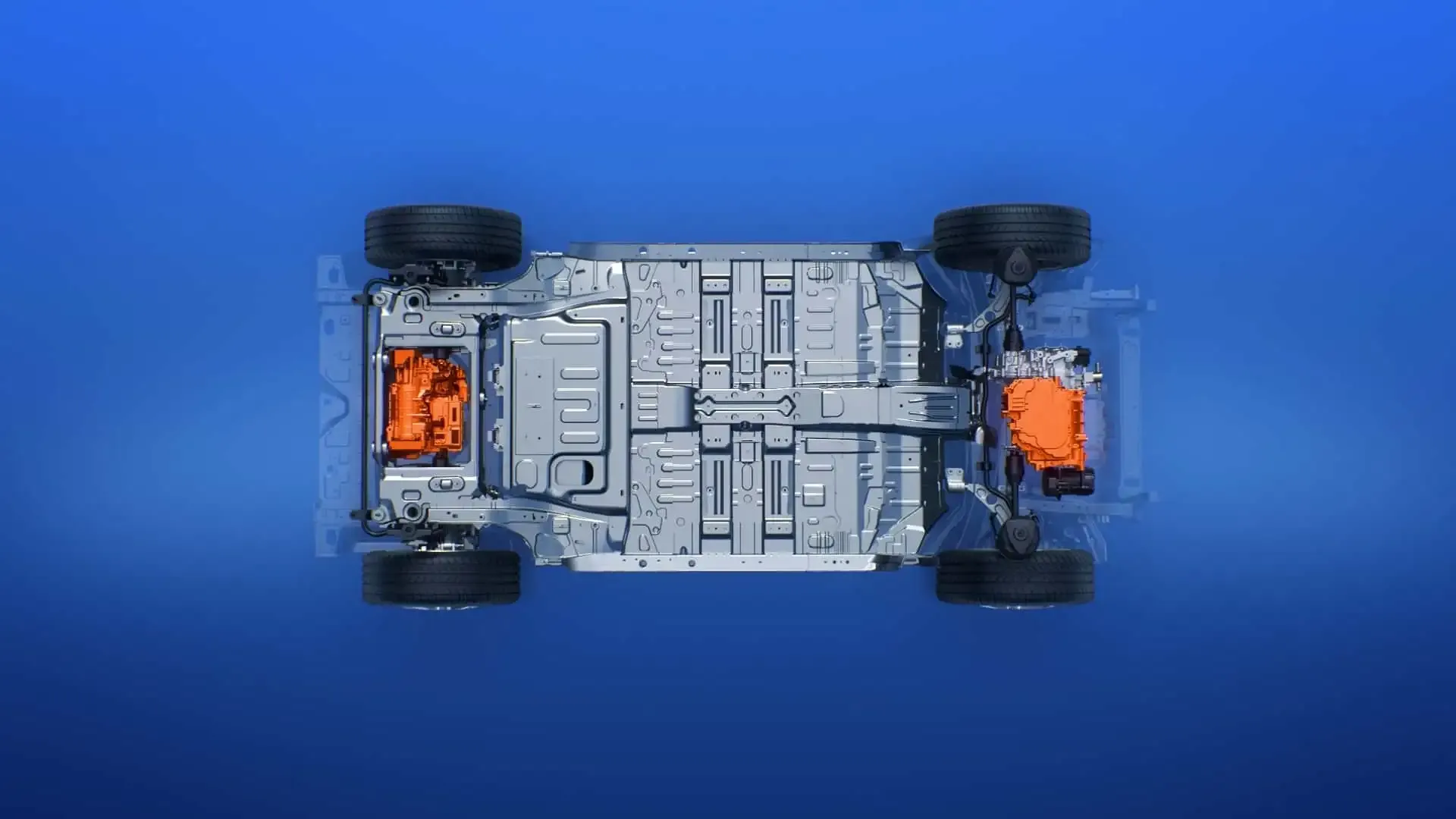 Vista dall'alto del telaio di un veicolo elettrico su sfondo blu, che mostra il pacco batteria, le ruote e i componenti arancioni per i sistemi elettrici.