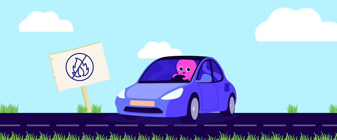 A cartoon pink character drives a blue car past a sign with a crossed-out fire symbol. The road is bordered by grass and a clear sky.