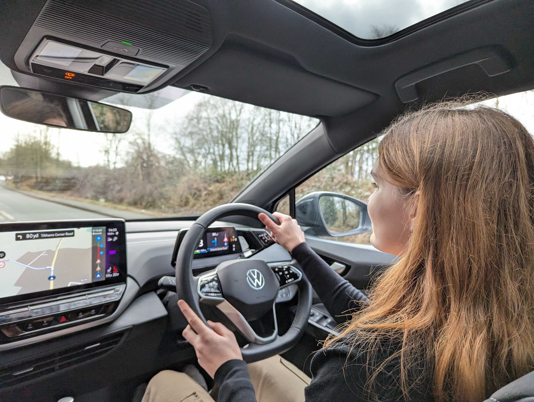 Woman driving an electric Volkswagen ID.5 