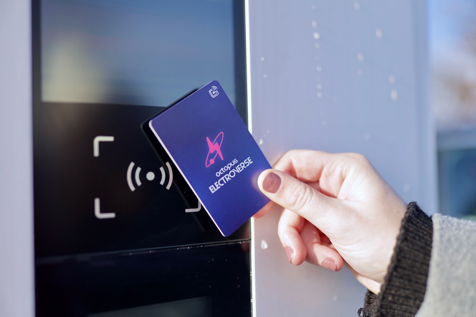 The Octopus Electroverse charging card - Electrocard - being tapped on an electric vehicle charger